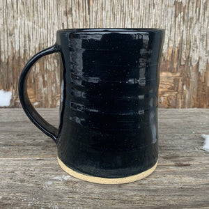 Black Mug on Speckled Clay